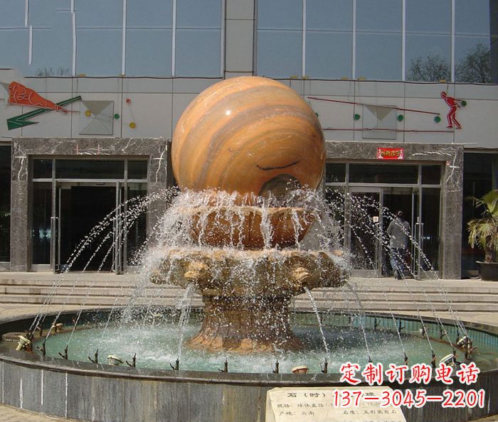 成都石来运转球晚霞红风水球石雕